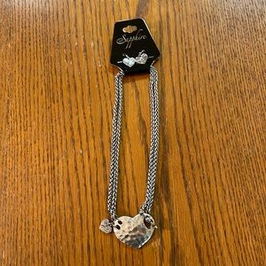 Sapphire silver colored heart necklace and matching earrings.